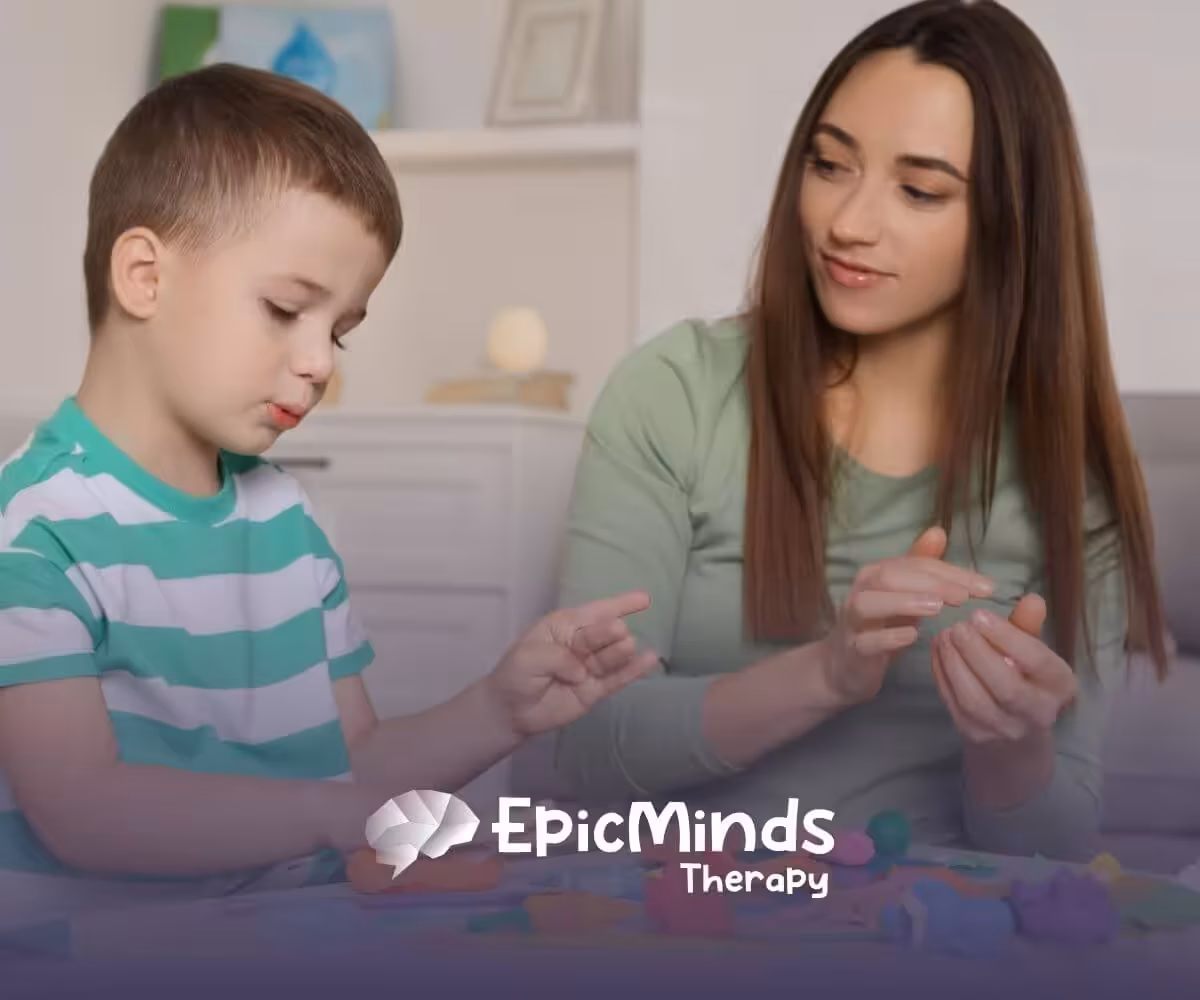 ABA therapist and autistic child playing with colorful playdough in ABA therapy.