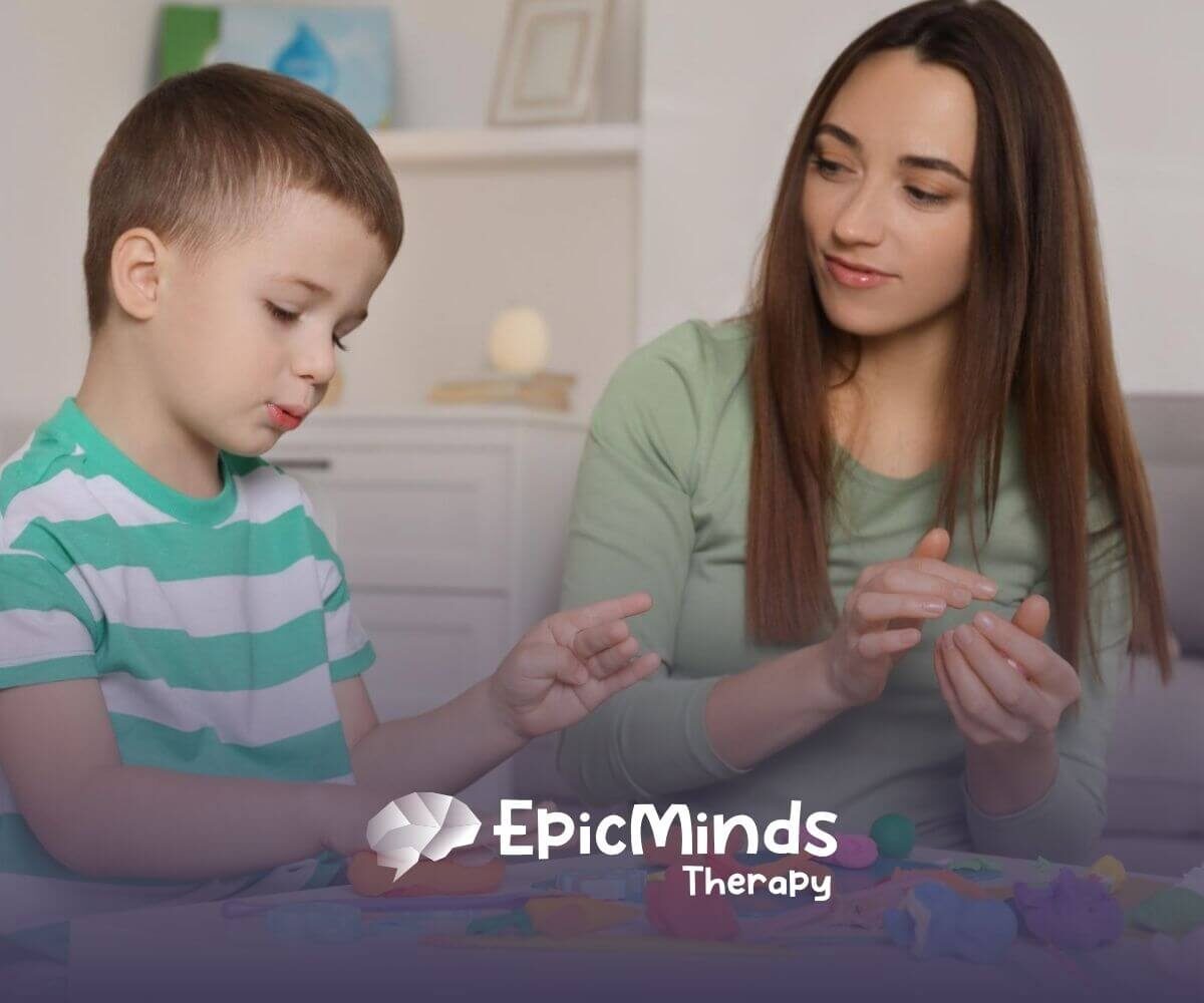 ABA therapist and autistic child playing with colorful playdough in ABA therapy.
