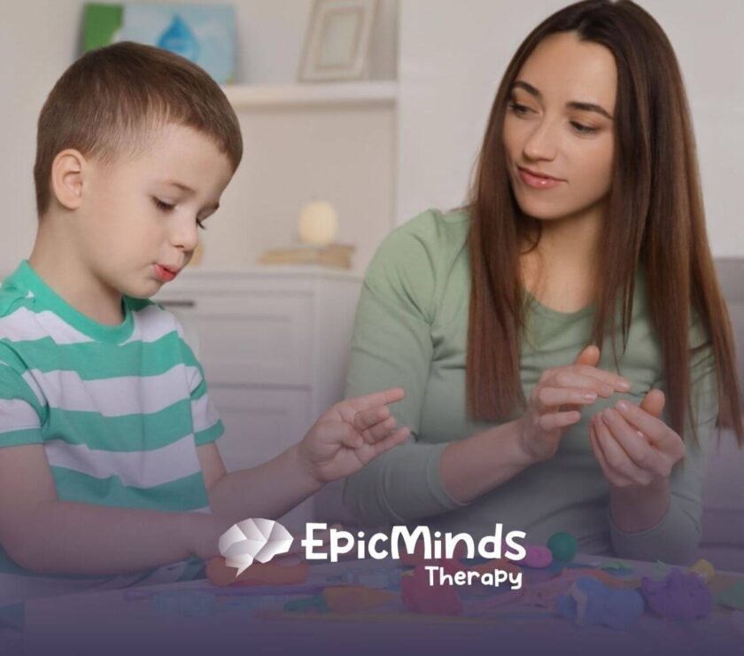 ABA therapist and autistic child playing with colorful playdough in ABA therapy.