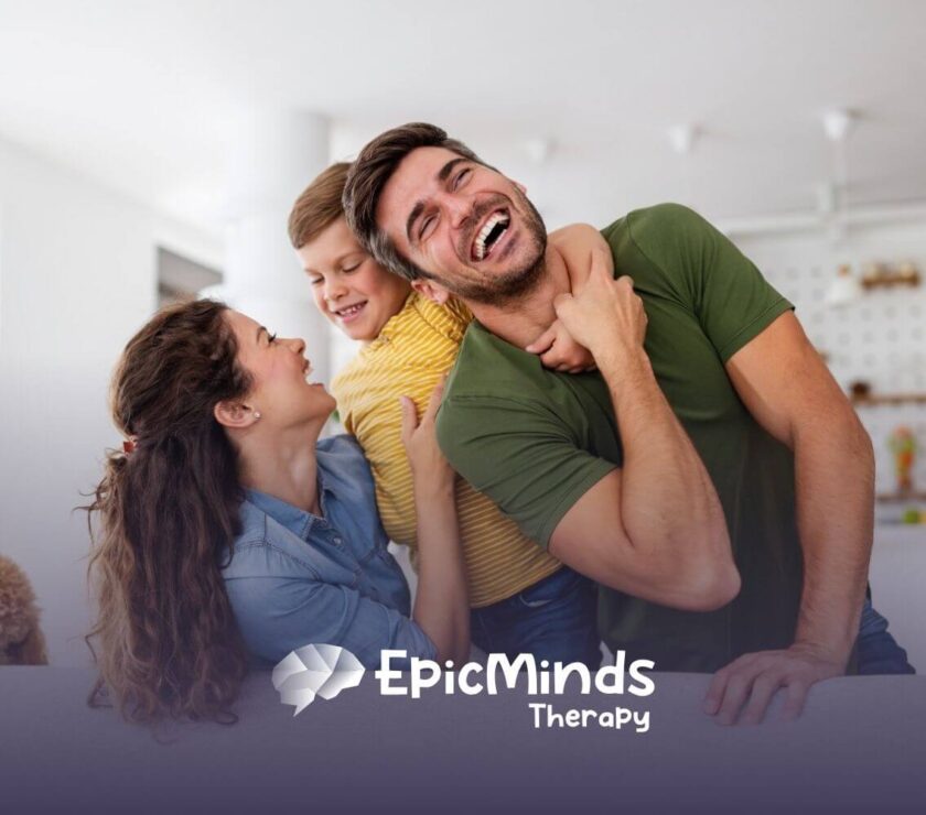 Happy family laughing together on a couch with their dog nearby.