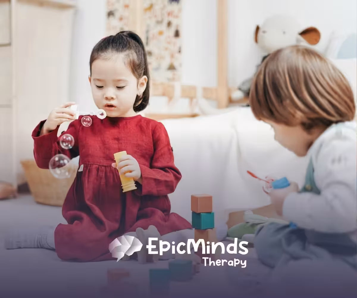 An autistic girl holding and inspecting a wooden toy helicopter at a table during ABA therapy in MD.