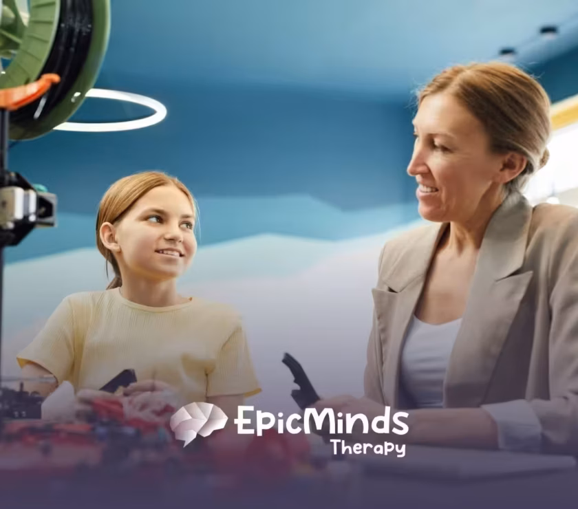 A BCBA and autistic child sitting in a creative space, talking and conducting autism evaluation in North Carolina.