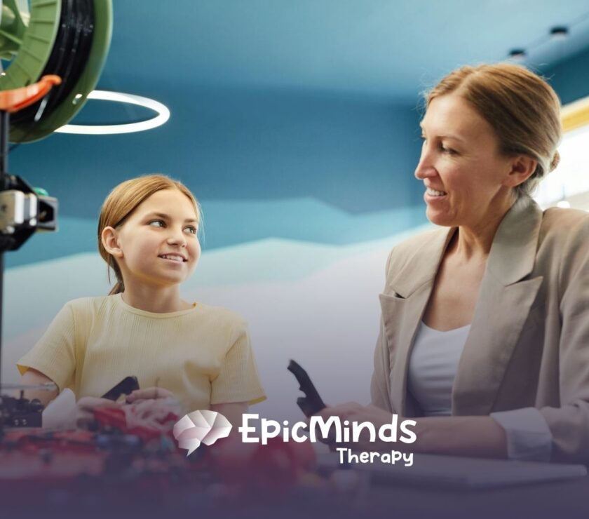 A BCBA and autistic child sitting in a creative space, talking and conducting autism evaluation in North Carolina.