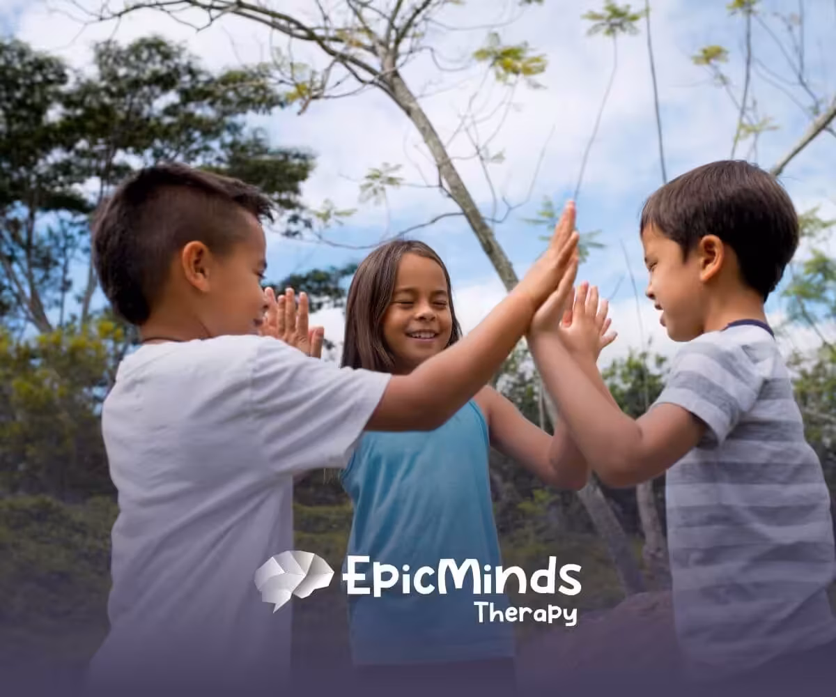 Three children in NC playing a hand-clapping game outdoors.