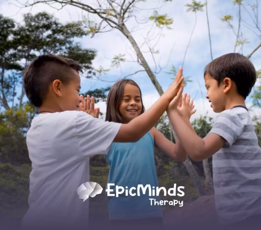Three children in NC playing a hand-clapping game outdoors.