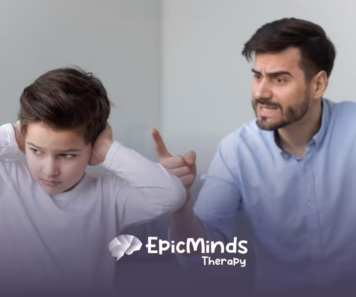 A boy with autism covering his ears while a man points and scolds him.