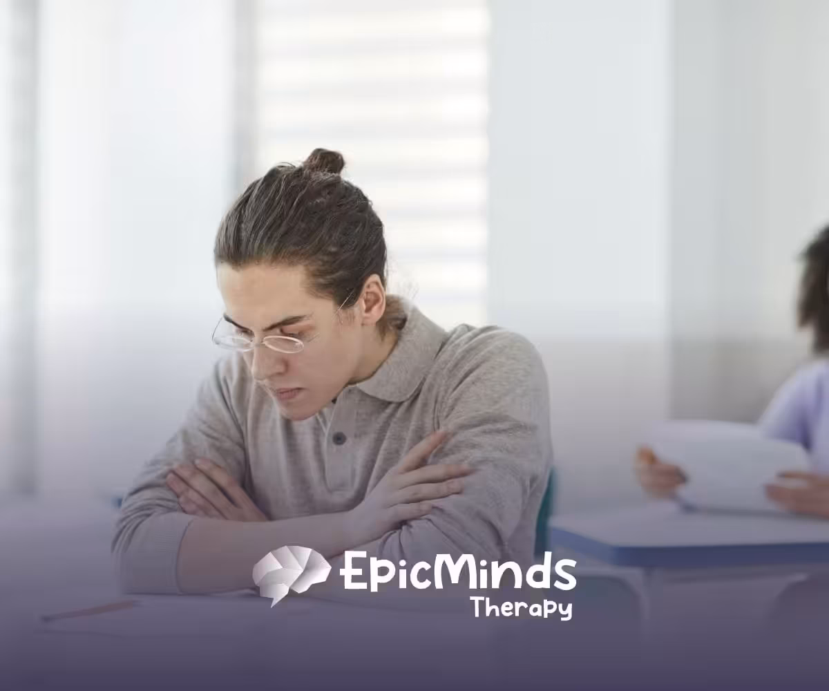 A BCBA student wearing glasses focused on answering the BCBA exam in North Carolina testing center.