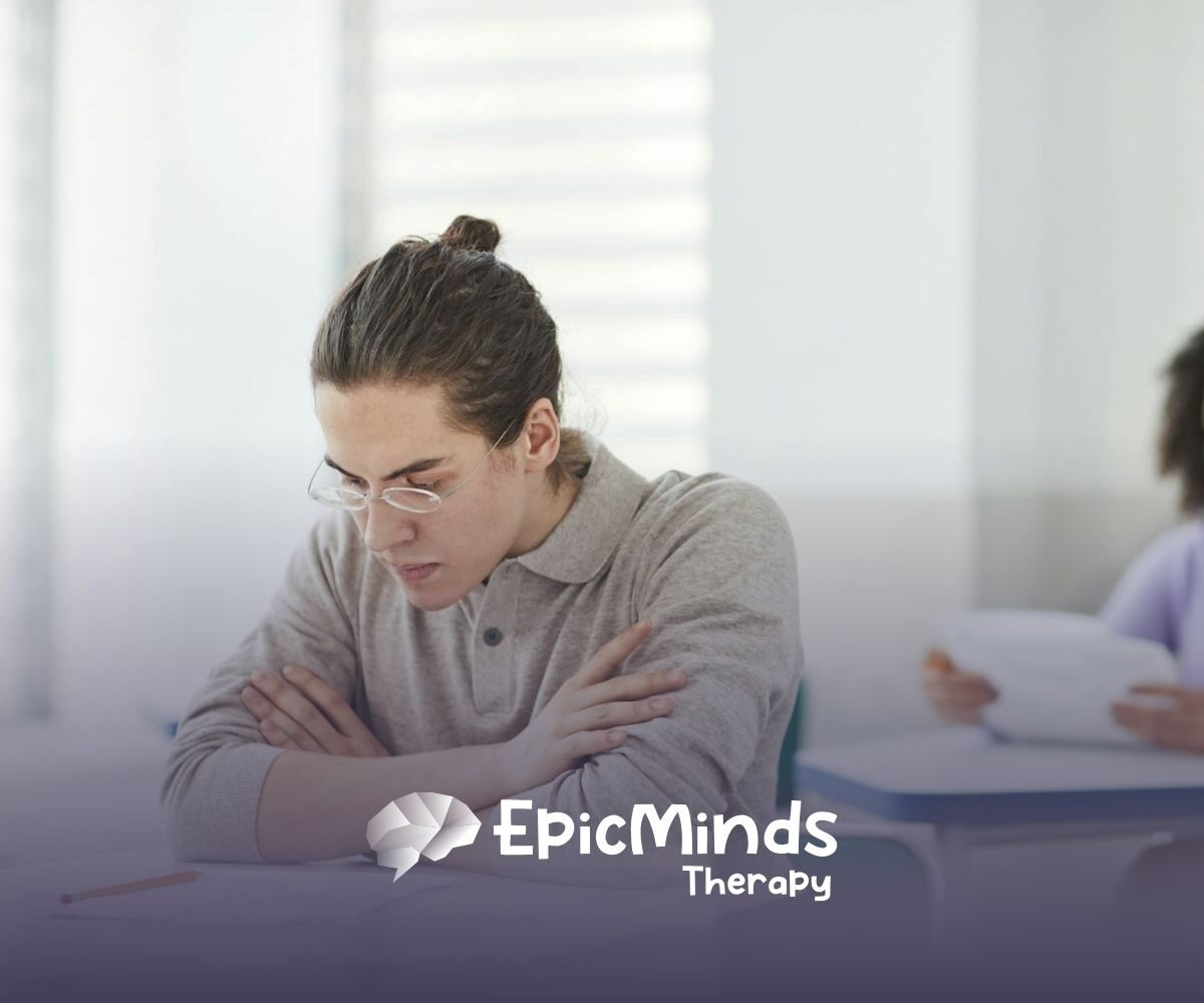 A BCBA student wearing glasses focused on answering the BCBA exam in North Carolina testing center.