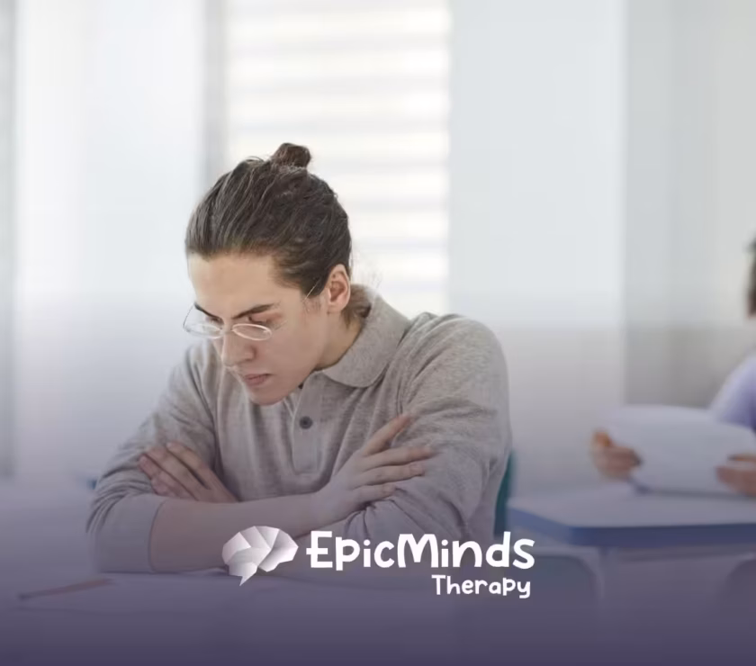 A BCBA student wearing glasses focused on answering the BCBA exam in North Carolina testing center.