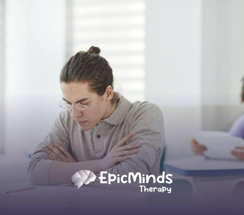 A BCBA student wearing glasses focused on answering the BCBA exam in North Carolina testing center.