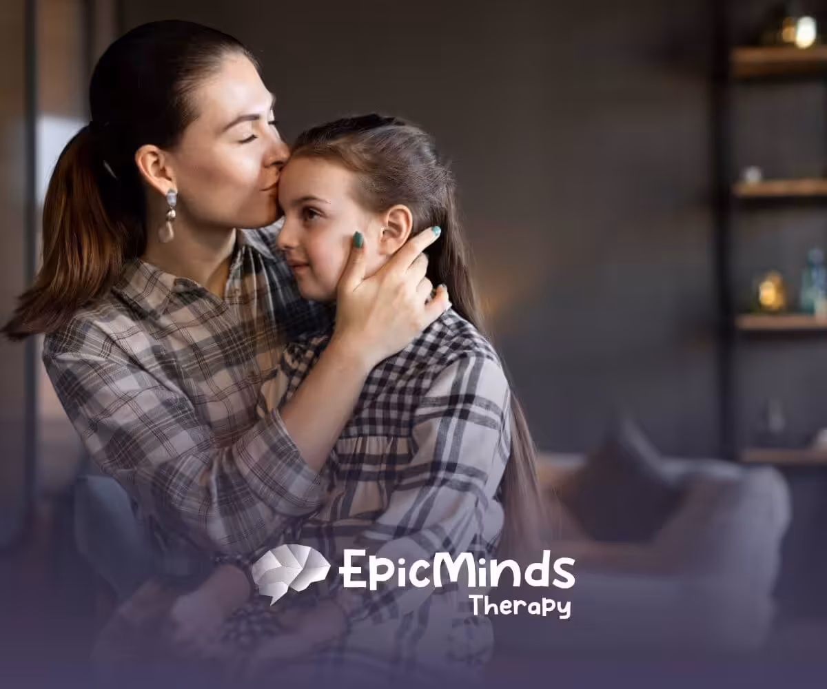 Mother hugging and kissing daughter with autism for comfort at home.