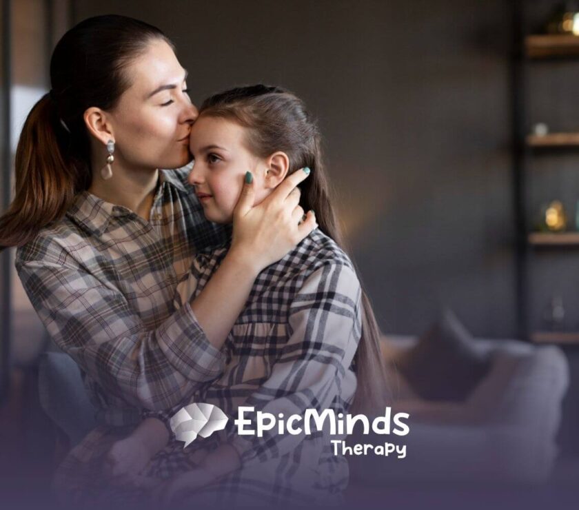 Mother hugging and kissing daughter with autism for comfort at home.