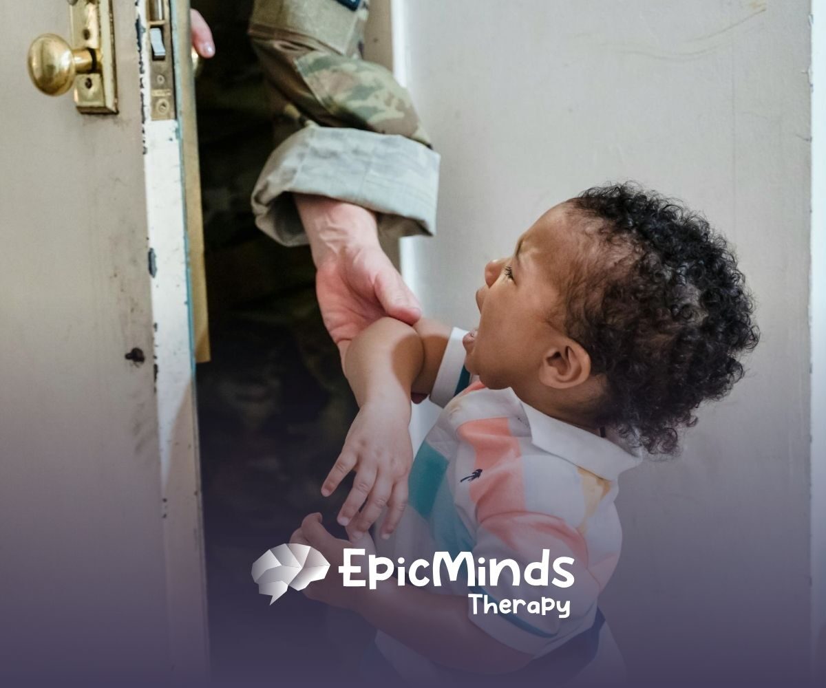An autistic toddler crying while being held near a door by an ABA therapist in uniform during ABA therapy in NC.