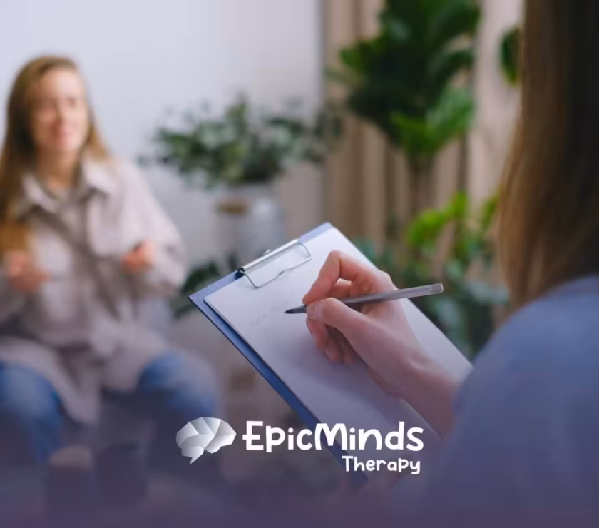 ABA Therapist writing notes during a counseling session with her applicant who is applying for the position for ABA Therapist