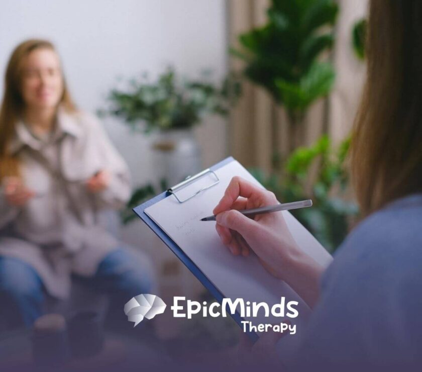 ABA Therapist writing notes during a counseling session with her applicant who is applying for the position for ABA Therapist