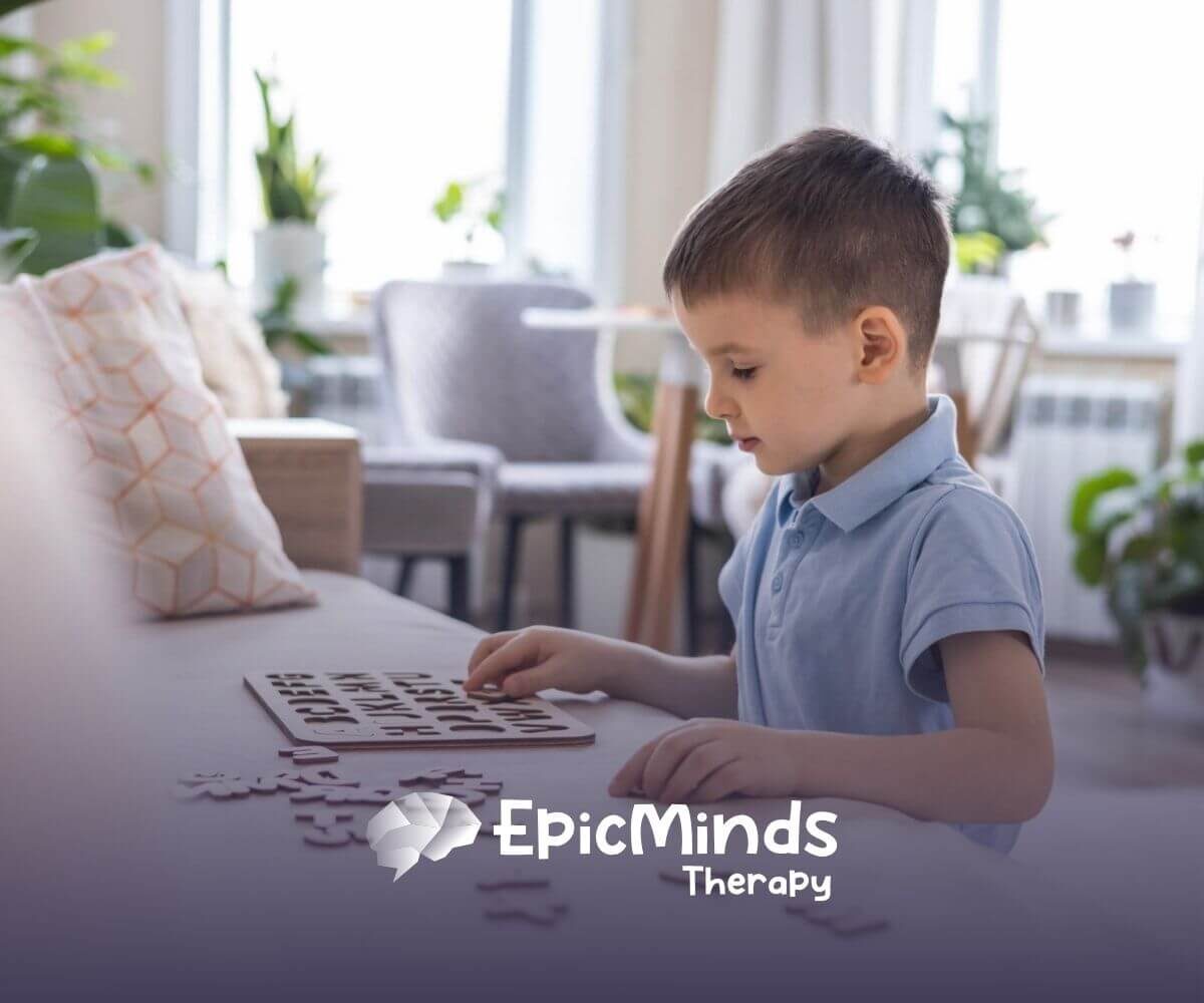 Child with autism focusing on colorful wooden shapes during ABA therapy.
