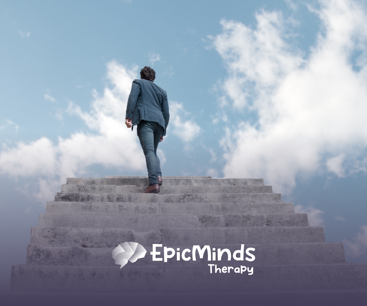 A back view of a man climbing stairs