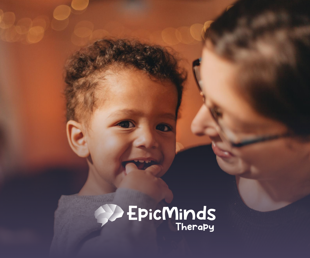 A young boy with autism being held by his mom