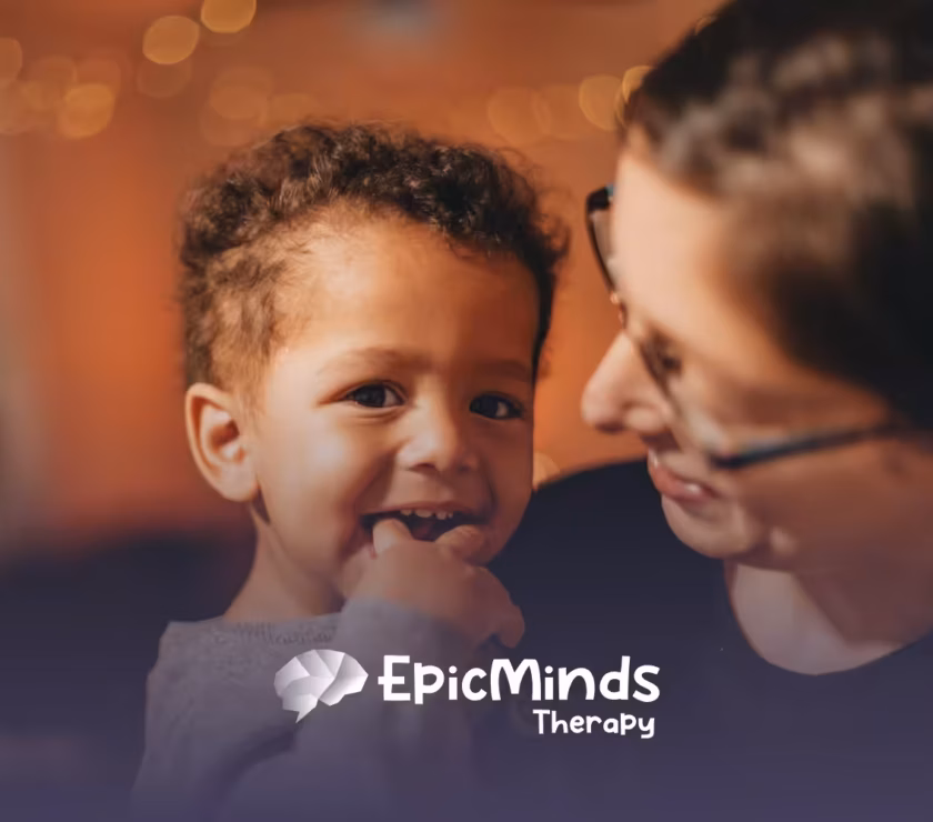 A young boy with autism being held by his mom