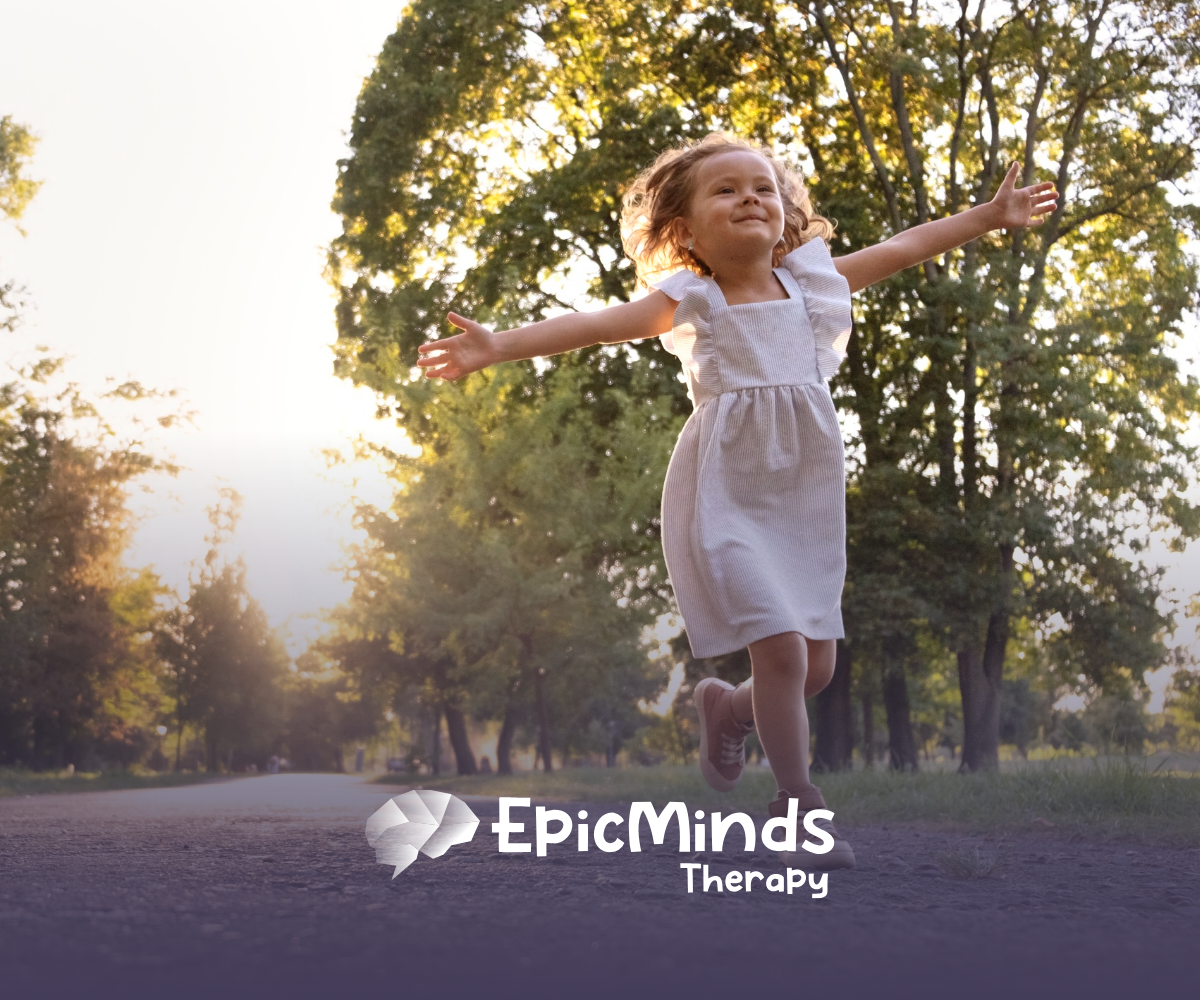 A girl happily running outdoors, arms open wide