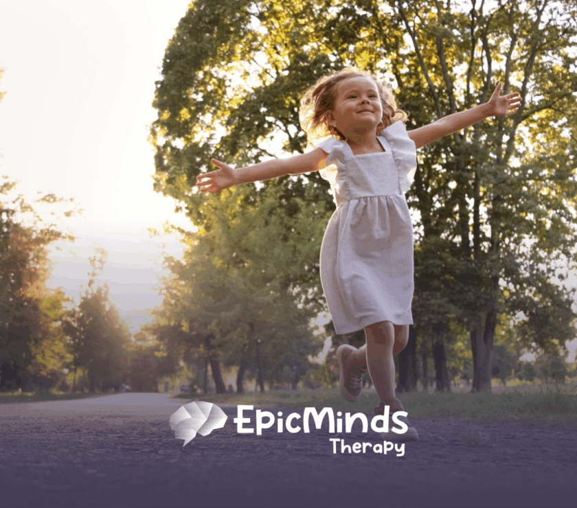A girl happily running outdoors, arms open wide