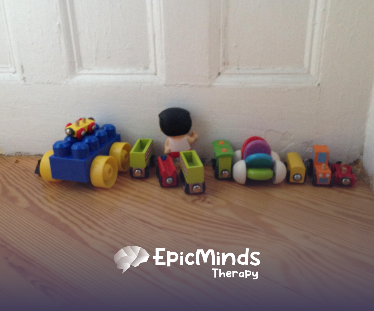 Toys lined up by a door