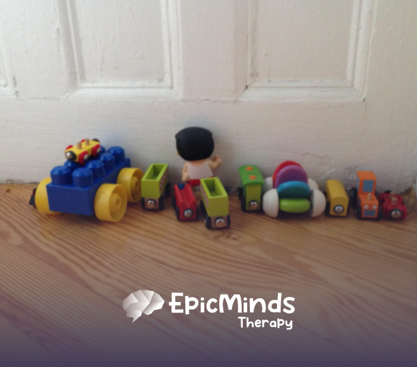 Toys lined up by a door